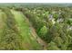 Aerial view of the golf course beside the neighborhood, showing a lush green landscape at 703 Kirkeenan Cir, Morrisville, NC 27560