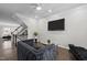 Comfortable living room with modern decor, a staircase, and plenty of space for relaxing at 703 Kirkeenan Cir, Morrisville, NC 27560