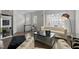 Elegant living room with a chic sofa, mirrored coffee table, and stylish decor at 703 Kirkeenan Cir, Morrisville, NC 27560