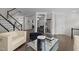 Open concept living room with elegant decor, stylish furniture, and hardwood floors at 703 Kirkeenan Cir, Morrisville, NC 27560