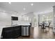 Open living space featuring a modern kitchen, dining area, and plenty of natural light at 703 Kirkeenan Cir, Morrisville, NC 27560