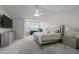 Spacious main bedroom with a vaulted ceiling, and a seating area by the window at 703 Kirkeenan Cir, Morrisville, NC 27560