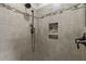Close up of the shower with tiled walls and a hand held shower fixture at 703 Kirkeenan Cir, Morrisville, NC 27560