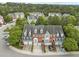 Street view of townhomes with brick and siding exteriors and attached garages at 703 Kirkeenan Cir, Morrisville, NC 27560