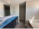 Bright bathroom featuring double vanity, and separate area with toilet and tub at 72 Ruskin Dr, Smithfield, NC 27577