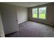 Bedroom features soft carpet and a double window view to the outside at 72 Ruskin Dr, Smithfield, NC 27577