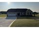 Charming single-story home with a well-manicured lawn and a two-car garage at 72 Ruskin Dr, Smithfield, NC 27577