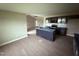 Open kitchen and eating area with an island, dark cabinets, stainless appliances, and light walls at 72 Ruskin Dr, Smithfield, NC 27577