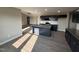 Well-lit kitchen with granite countertops, an island, and dark wood cabinets at 72 Ruskin Dr, Smithfield, NC 27577