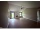 Bright living room featuring high ceilings, ceiling fan, wood-look flooring, and a fireplace at 72 Ruskin Dr, Smithfield, NC 27577