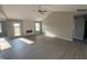 Bright living room features vaulted ceilings, wood floors, and a modern fireplace at 72 Ruskin Dr, Smithfield, NC 27577