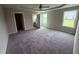 Spacious main bedroom with soft carpet, neutral walls, and two windows for lots of natural light at 72 Ruskin Dr, Smithfield, NC 27577