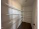 Walk-in pantry with installed metal shelving providing organized space and maximizing storage at 72 Ruskin Dr, Smithfield, NC 27577