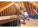 Spacious attic offering ample storage with exposed wooden beams and some holiday decorations at 7321 Clarincarde Ct, Wake Forest, NC 27587