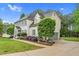Stately two-story home with pristine white exterior, well-manicured landscaping and driveway at 7321 Clarincarde Ct, Wake Forest, NC 27587