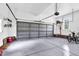 Spacious two-car garage with sealed flooring and ample storage, perfect for vehicles and projects at 7321 Clarincarde Ct, Wake Forest, NC 27587