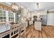 Open-concept kitchen featuring modern appliances, granite countertops, and custom cabinetry at 7321 Clarincarde Ct, Wake Forest, NC 27587