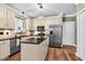 Spacious kitchen with stainless steel appliances, granite countertops and wooden floors at 7321 Clarincarde Ct, Wake Forest, NC 27587