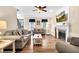 Comfortable living room featuring hardwood floors, a fireplace, and neutral-toned furnishings at 7321 Clarincarde Ct, Wake Forest, NC 27587
