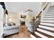 Cozy living room with fireplace, tv, and hardwood floors, adjacent to staircase at 7321 Clarincarde Ct, Wake Forest, NC 27587
