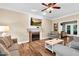 Inviting living room with a fireplace and a flatscreen TV above the mantle at 7321 Clarincarde Ct, Wake Forest, NC 27587