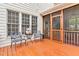 Cozy porch area with outdoor seating and access to the screened porch at 7321 Clarincarde Ct, Wake Forest, NC 27587