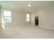 Spacious bedroom with ample natural light and neutral decor at 737 W Holly Springs Rd, Holly Springs, NC 27540