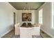 Elegant dining room featuring a decorative chandelier, large painting, and a window at 737 W Holly Springs Rd, Holly Springs, NC 27540