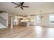 The open kitchen is complete with an island, modern lighting, stainless appliances, and ample counter space at 749 W Holly Springs Rd, Holly Springs, NC 27540