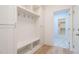 The spacious mudroom features custom-built storage and a bench for convenience at 749 W Holly Springs Rd, Holly Springs, NC 27540