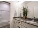 Bathroom with double vanity, sleek countertops, and modern fixtures at 755 W Holly Springs Rd, Holly Springs, NC 27540