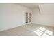Bedroom featuring french doors and neutral carpeting at 755 W Holly Springs Rd, Holly Springs, NC 27540