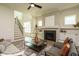 Open concept living room showcasing a fireplace, staircase, and natural light at 755 W Holly Springs Rd, Holly Springs, NC 27540