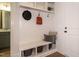 Organized mudroom featuring a built-in bench, storage baskets, and a stylish design at 755 W Holly Springs Rd, Holly Springs, NC 27540