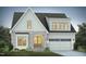 Charming two-story home with gray brick, white siding, an attached two-car garage, and manicured landscaping at 761 W Holly Springs Rd, Holly Springs, NC 27540