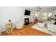 Inviting living room features a fireplace, hardwood floors, and plenty of natural light at 8009 Tobin Pl, Raleigh, NC 27612
