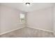 Bedroom featuring a bright window and soft neutral carpet at 8013 Toddwick Ct, Raleigh, NC 27616