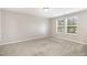 Neutral bedroom with carpet and natural light from two windows at 8013 Toddwick Ct, Raleigh, NC 27616