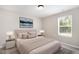 Beautiful bedroom styled with soft lighting, area rug, and an elegant bed at 8013 Toddwick Ct, Raleigh, NC 27616