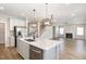 Open kitchen with a large island and stainless steel appliances at 8013 Toddwick Ct, Raleigh, NC 27616