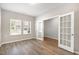 Bright office space with hardwood floors, neutral walls, and double French doors at 8013 Toddwick Ct, Raleigh, NC 27616