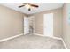 Bedroom featuring neutral carpet, a ceiling fan, and doorways leading to other rooms in the home at 817 S Creek Dr, Nashville, NC 27856