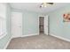 Neutral bedroom featuring carpet, an open doorway, and ample natural light at 817 S Creek Dr, Nashville, NC 27856