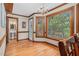 Sunlit breakfast nook with views to the outdoors and access to a powder room at 817 S Creek Dr, Nashville, NC 27856