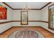 Elegant dining room features hardwood floors and natural light at 817 S Creek Dr, Nashville, NC 27856