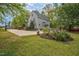Two-story home with manicured landscaping and expansive driveway at 817 S Creek Dr, Nashville, NC 27856