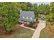 A two-story home boasts a welcoming front porch and well-manicured landscaping, complemented by a charming shed at 817 S Creek Dr, Nashville, NC 27856