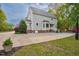 Attractive two-story home with a wide driveway, lush lawn, and manicured landscaping at 817 S Creek Dr, Nashville, NC 27856