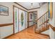 Welcoming foyer featuring hardwood floors and staircase at 817 S Creek Dr, Nashville, NC 27856