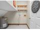 Functional laundry room with shelving and a water heater in a utility space at 817 S Creek Dr, Nashville, NC 27856